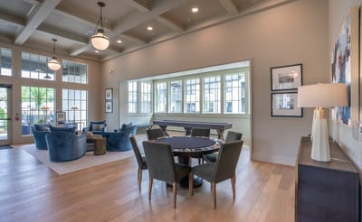 Interior common area with seating and a game table