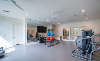 Interior view of a fitness room with exercise equipment