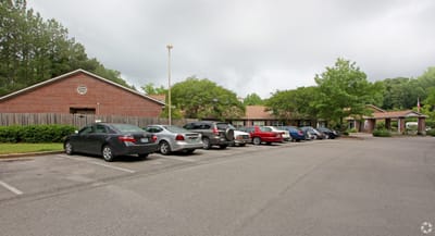 Exterior view of the facility with parking area