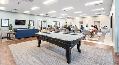 Residents participating in an activity in a community room