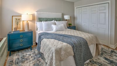Cozy interior of a resident room with a bed and decor