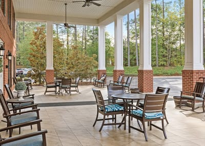 Outdoor seating area with tables and chairs