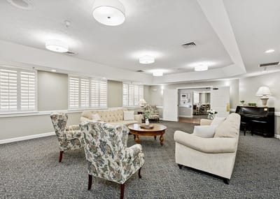 Common area seating with piano in the background