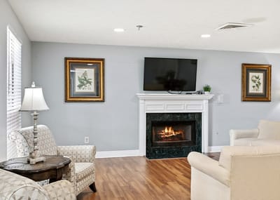 Cozy lounge area with a fireplace and comfortable seating