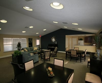 Bright, spacious common area with dining tables