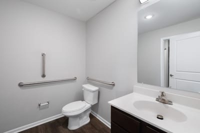 Clean and accessible bathroom with grab bars