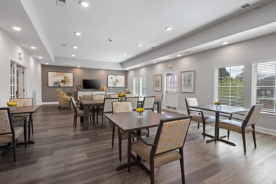Bright common area with tables and chairs