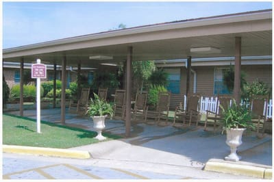 Covered outdoor seating area with rocking chairs