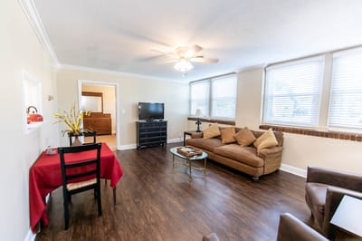 Interior living room of a senior living unit with furniture and decorations