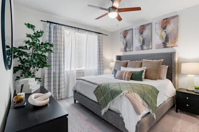 Comfortable bedroom with stylish decor and natural light