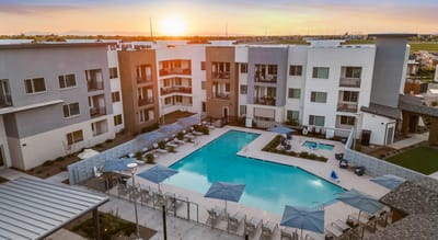 Aerial view of a modern assisted living facility with a pool