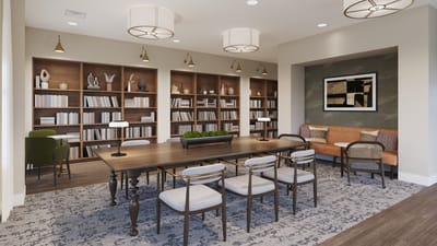A bright common area with bookshelves and seating