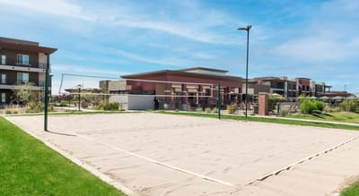 Outdoor sand volleyball court at a senior living facility