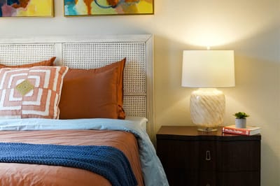Cozy private bedroom with bedside lamp and decor