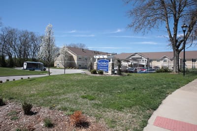 Exterior view of The Springs at Stony Brook with landscaping