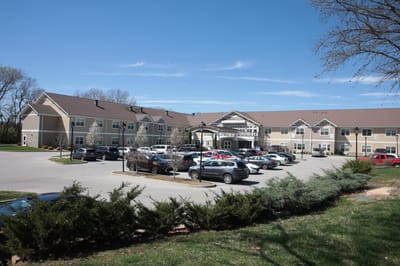 Exterior view of The Springs at Stony Brook with parking area