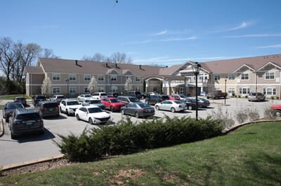 Exterior view of The Springs at Stony Brook with parking lot