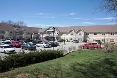 Exterior view of The Springs at Stony Brook with parking lot