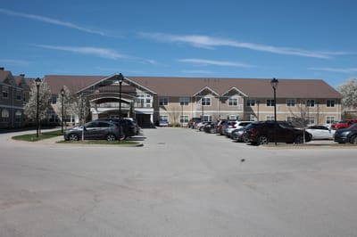 Exterior view of The Springs at Stony Brook with parking lot