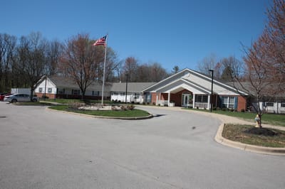 Exterior view of a senior living facility with landscaping
