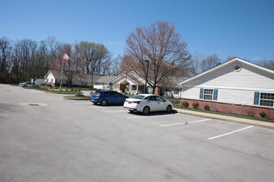 Outdoor view of the assisted living facility with parking