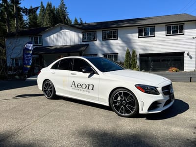 Aeon Senior Living branded vehicle in front of facility