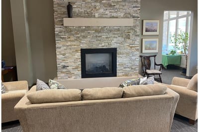 Cozy common area with a fireplace and comfortable seating