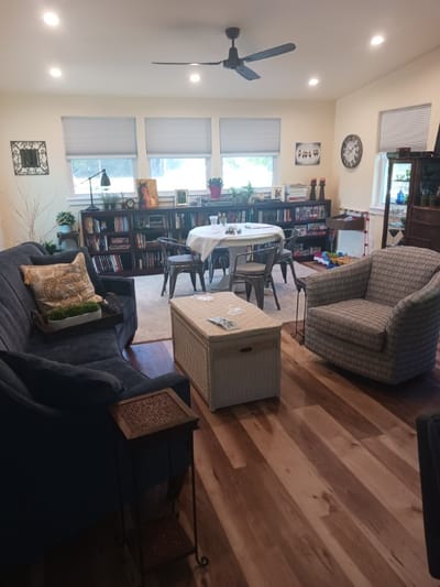 Cozy common area with seating and bookshelves