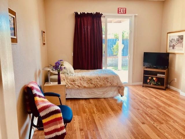 Cozy private room with a bed and seating area