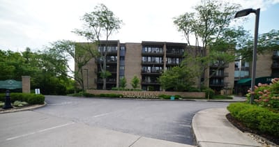 Exterior view of Deupree House with landscaping