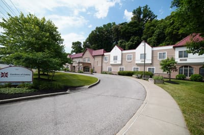 Exterior view of Gardens of Oakley with surrounding greenery