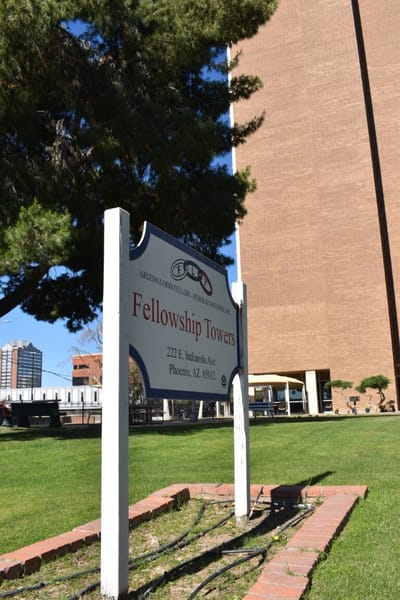 Sign for Fellowship Towers outside the building