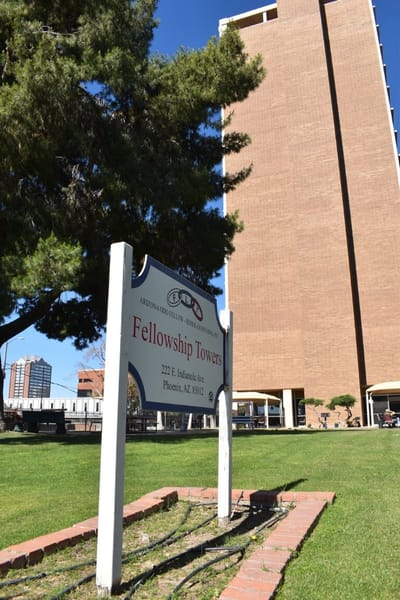 Fellowship Towers building with sign in the foreground