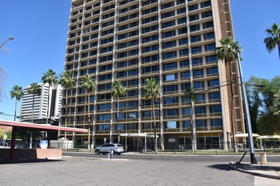 Exterior view of Fellowship Towers with palm trees