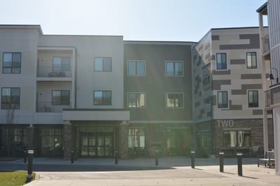 Exterior view of Clark Retirement facility at Keller Lake
