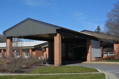 Entrance of St. Ann's Home with a covered area
