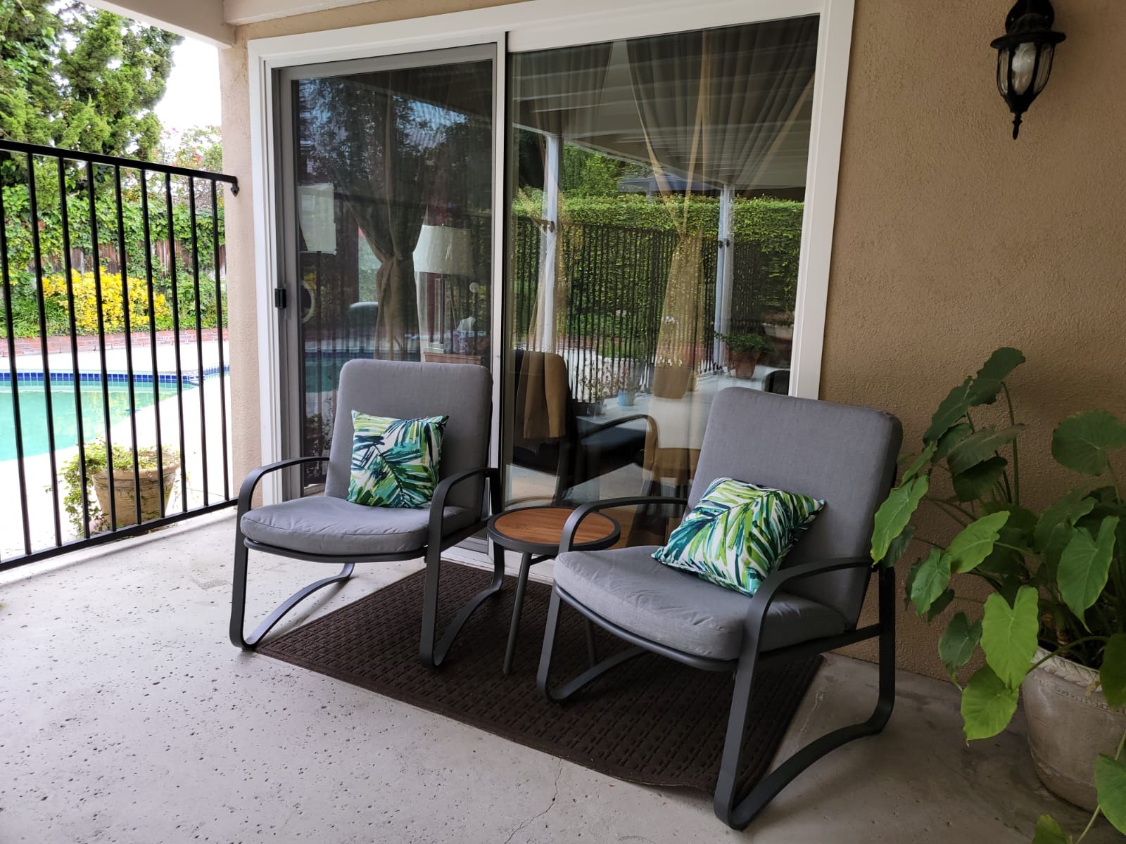 Outdoor seating area with pool view