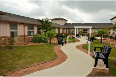 Pathway and seating area in the courtyard of the facility