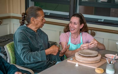 Residents enjoying a pottery activity together