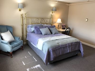 Cozy bedroom with a bed and seating area
