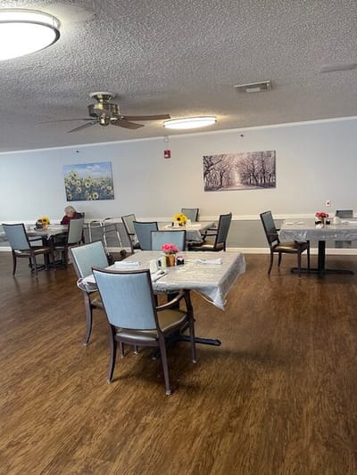 Dining area with tables set for residents