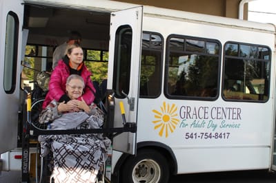 Resident boarding a facility shuttle bus