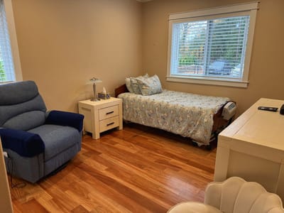 Cozy resident room with bed and seating