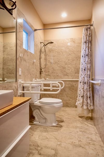 Accessible bathroom with grab bars and modern fixtures