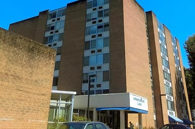 Exterior view of the facility building with signage
