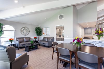 Bright common area with seating and flowers