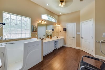 Bright, spacious assisted living bathroom with modern fixtures