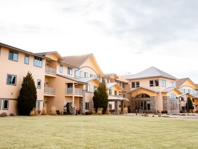 Exterior view of Fox Run Apartments with landscaped garden
