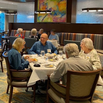 Residents enjoying a meal in the dining room