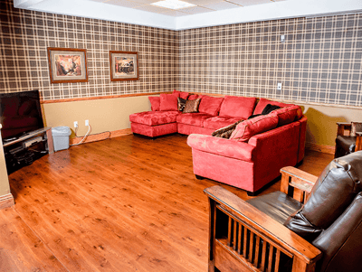 Cozy common area with a sectional sofa and artwork